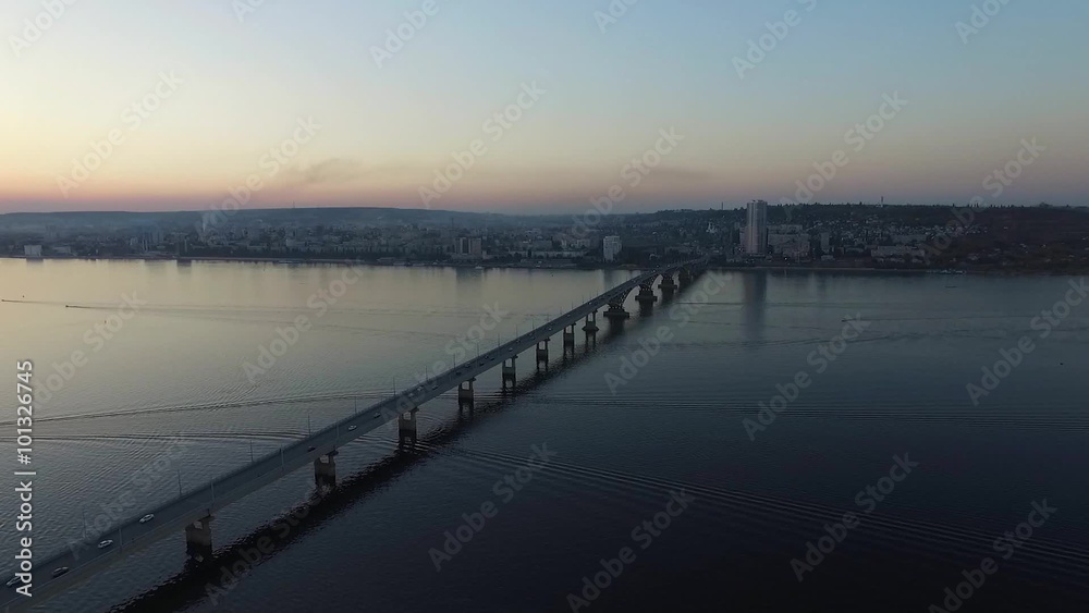 Evening flight over the bridge in the town of Saratov in autumn Evening flight over the bridge in the town of Saratov in autumn