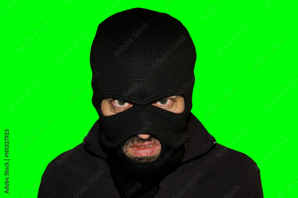 Man in a mask and a black shirt. Balaclava.