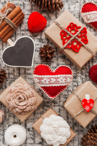 Valentine's Day symbols - hearts, presents in craft paper, decorations.