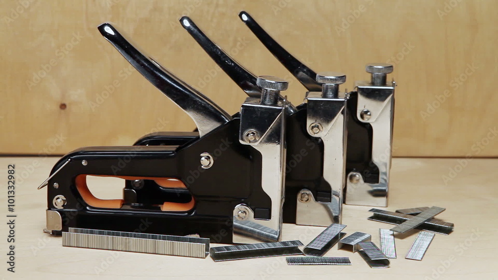 The tool - stapler manual mechanical - for repair work in the house and on furniture, and brackets The tool - stapler manual mechanical - for repair work in the house and on furniture, and brackets
