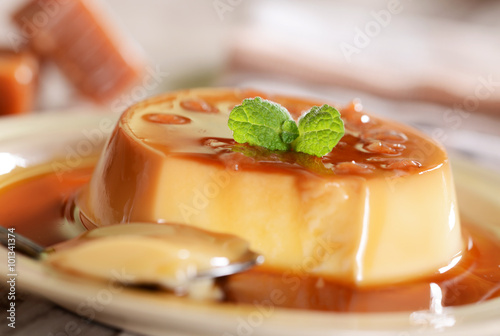 Panna cotta dessert with caramel sauce photo
