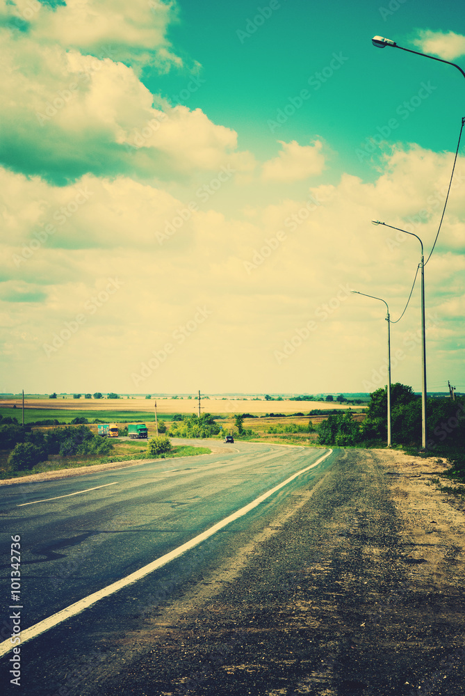 Rural Landscape Road. Clouds on Horizon Sky