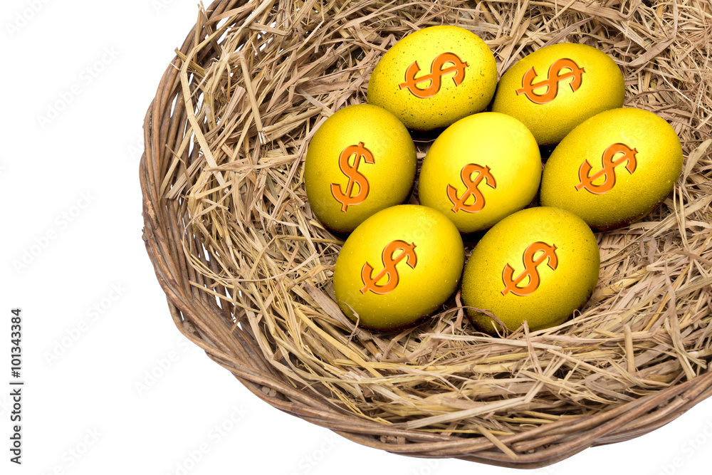 Fototapeta premium Gold eggs on straw on wicker basket isolated and include path