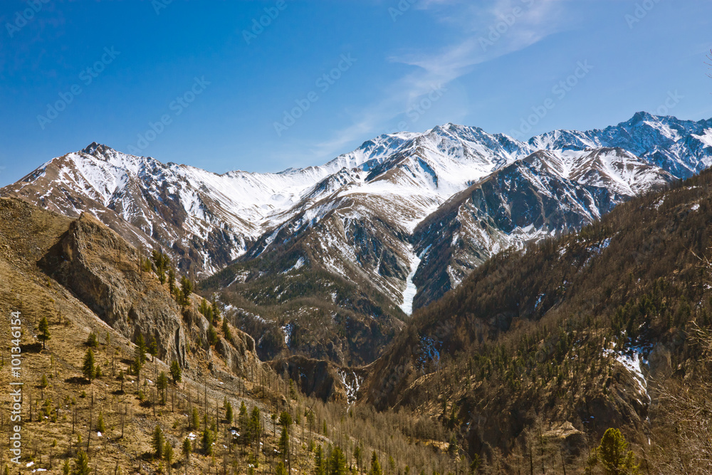 Landscape of the peaks of the Eastern Sayan in the snow