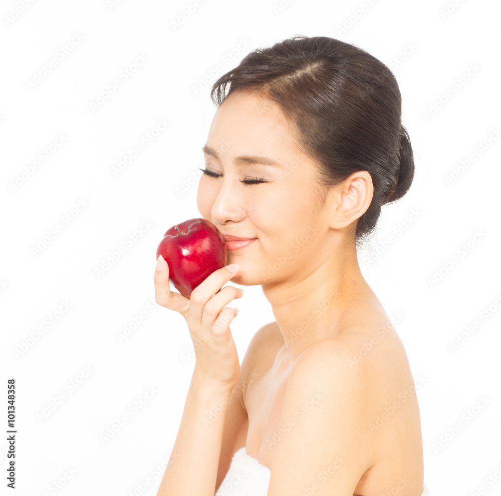 Young woman holding an apple. Young woman holding an apple.