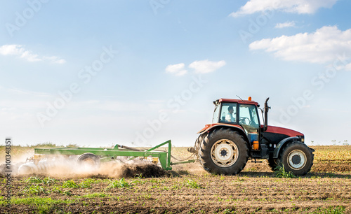 Tractor preparing land