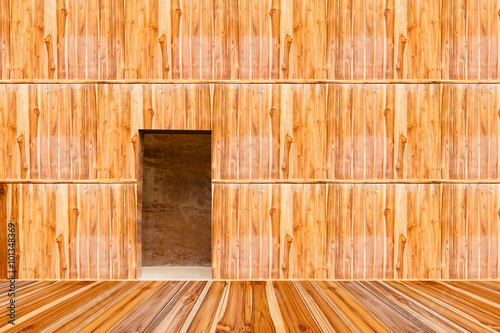 wooden wall with door and wood floor in front off