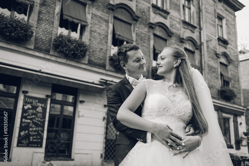 Glowing with happiness. Low angle portrait of a happy married couple embracing looking at each other smiling joyfully