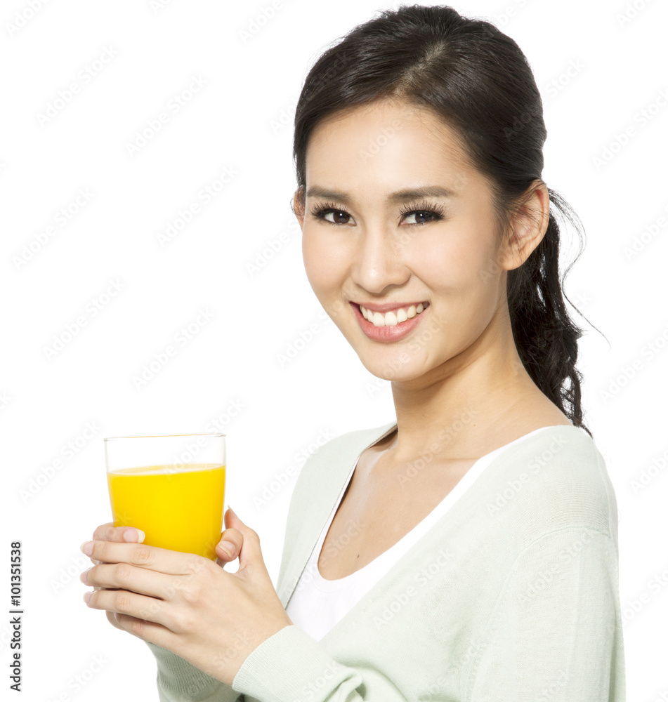 Young woman holding a glass of orange juice. Young woman holding a glass of orange juice.