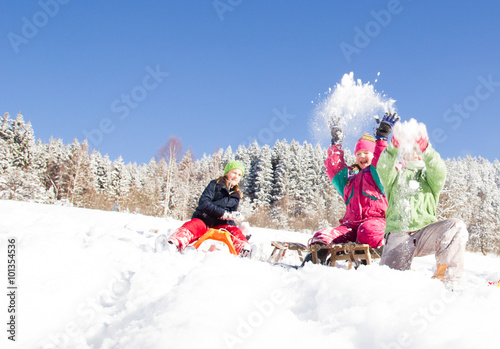 Happy children  at winter time. Group of children spending a nice time in snow
