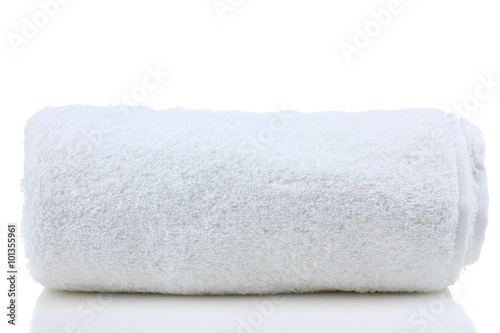 Fotografie soft bath towel rolled up on a white isolated background