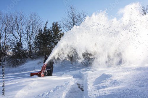 Принти на полотні Man plowing the snow in the morning
