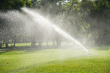 watering in green grass field