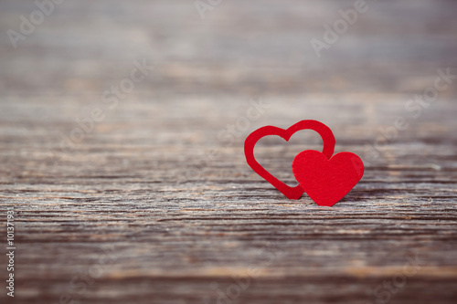 Red heart on old wooden background