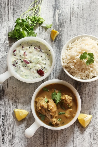 Chicken curry with rice and cucumber salad