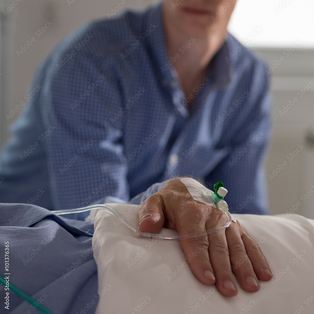 Fotografie Man watching his ill father