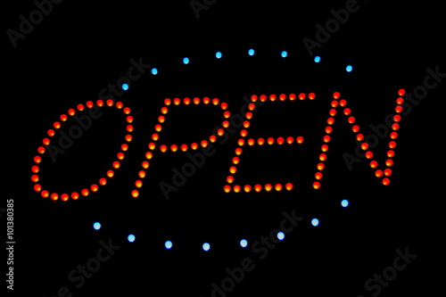 Red neon lighting sign open illuminating at night