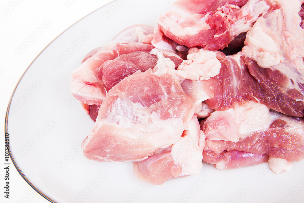 Fresh damp meat on plate insulated on white background Fresh damp meat on plate insulated on white background