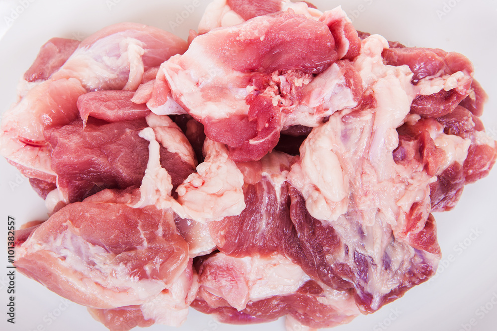 Fresh damp meat on plate insulated on white background