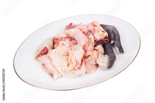 Chicken, cut into pieces on a white background.