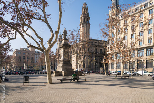 Placa de Antonio Lopez close to the main street Via Laietana in the Born/La Ribera district of Barcelona. In the background behind the monument the main post office of the Ciutat Vella and Barcelona photo