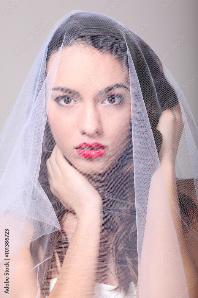 Fototapeta premium Beautiful girl with a white tulle