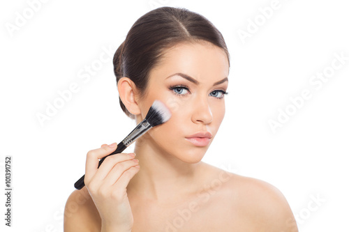 Woman applying blusher