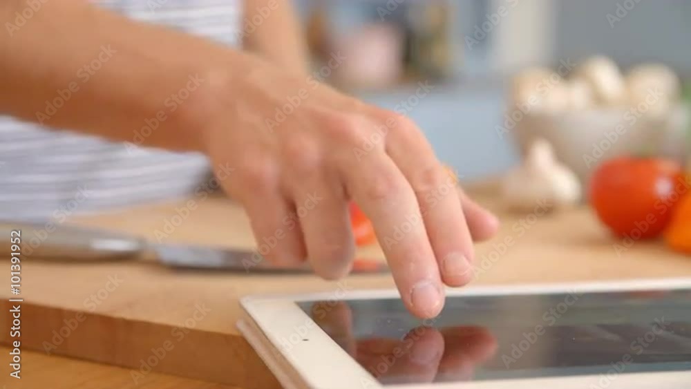 Man Follows Recipe On Digital Tablet In Kitchen Shot On R3D Man Follows Recipe On Digital Tablet In Kitchen Shot On R3D