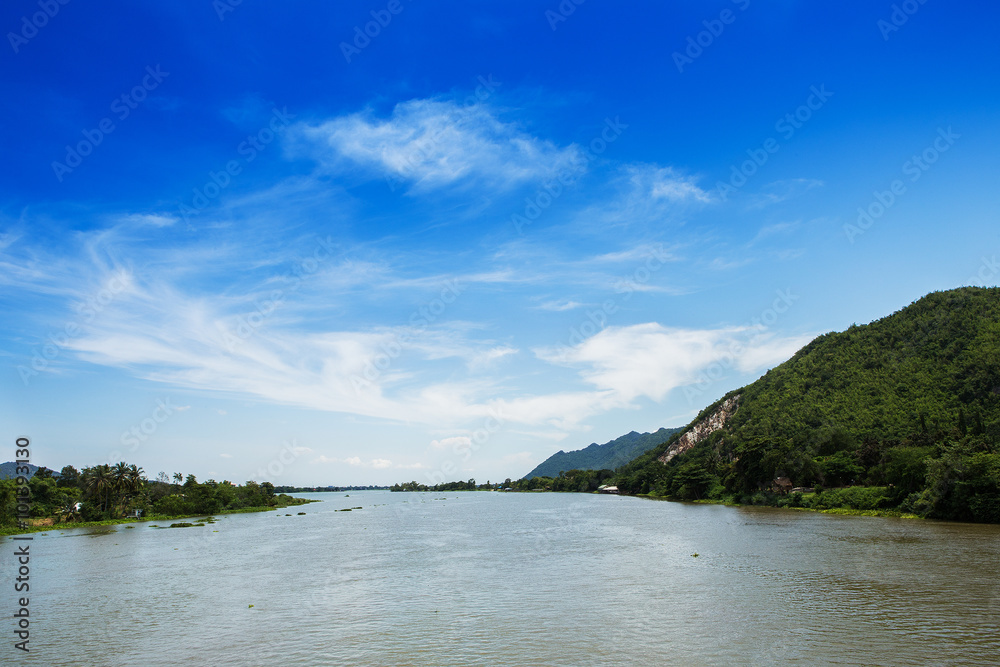 River with mountains and sky, Thailand.