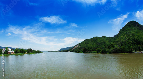 River with mountains and sky, Thailand.