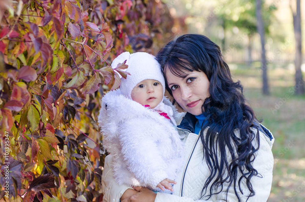 Mom and child in the park in autumn Mom and child in the park in autumn