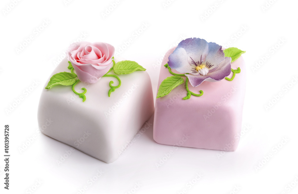 two beautiful decorated marzipan cakes isolated on white two beautiful decorated marzipan cakes isolated on white