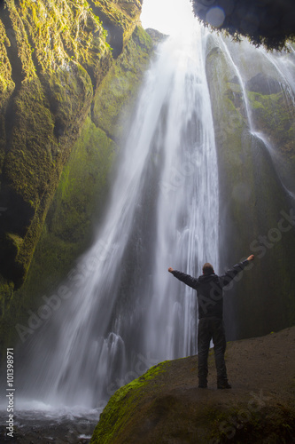 Traveler near Gljufrafoss waterfall
