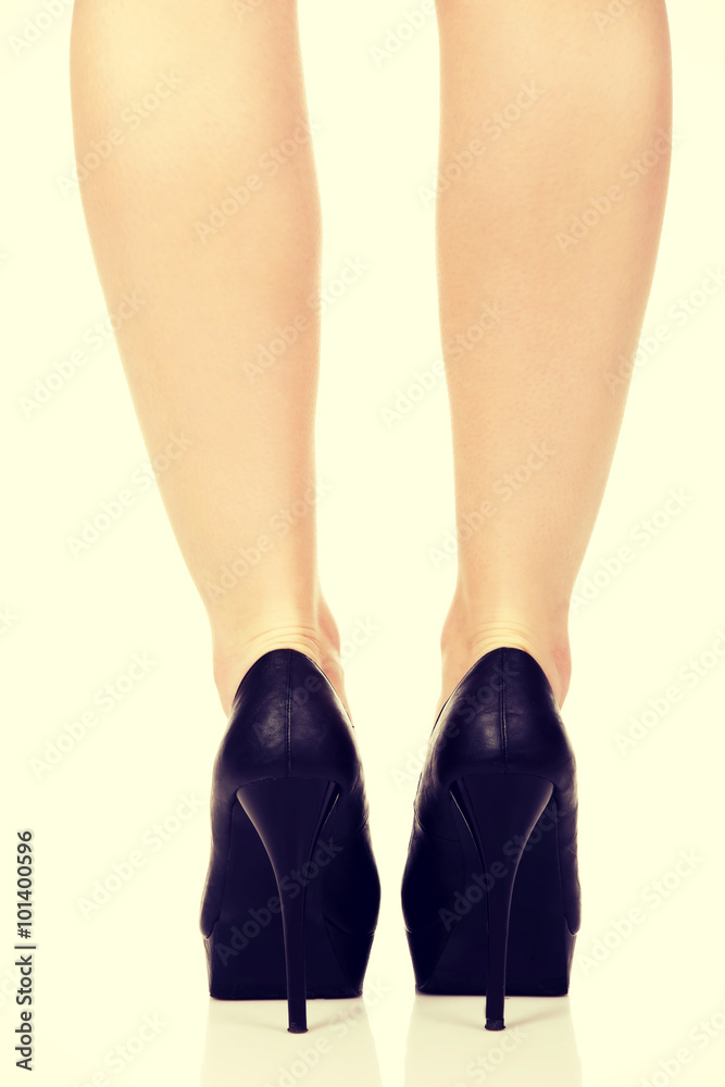 Woman legs with black sexy shoes. .