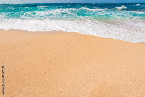 Beautiful beach and tropical sea. Sand and water vacation background.