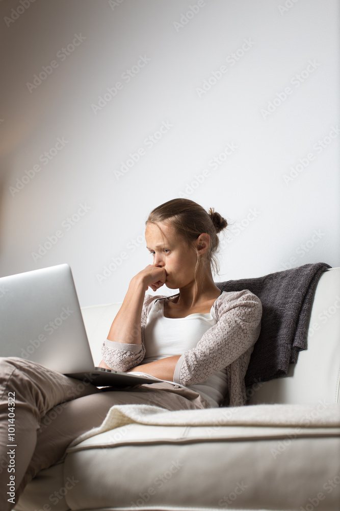 Very tired young woman, burning the midnigh oil - working late a