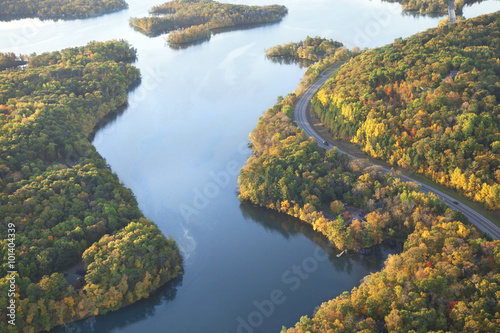 Curving road along Mississippi River during autumn photo
