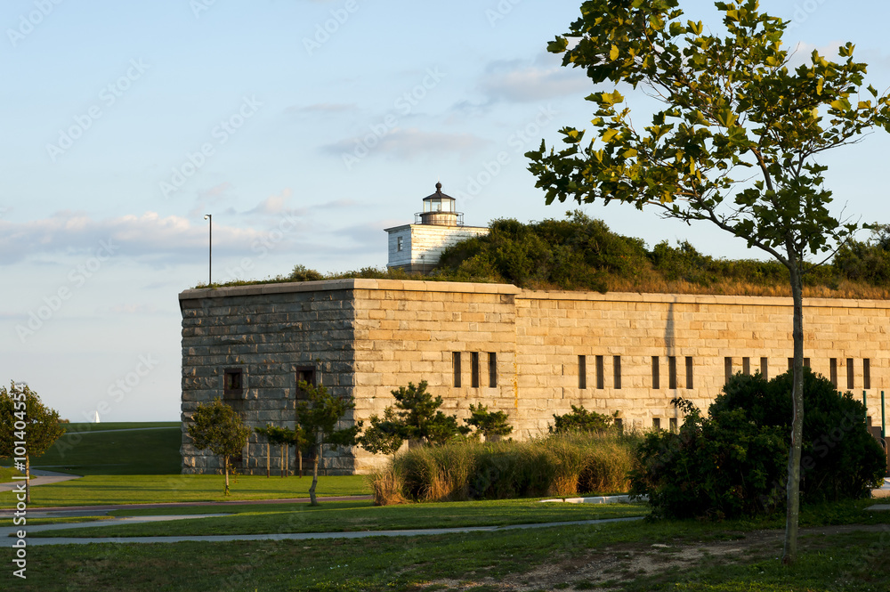 Old Lighthouse Tower On Top of Stone Fort as Sun Sets Illuminating ...