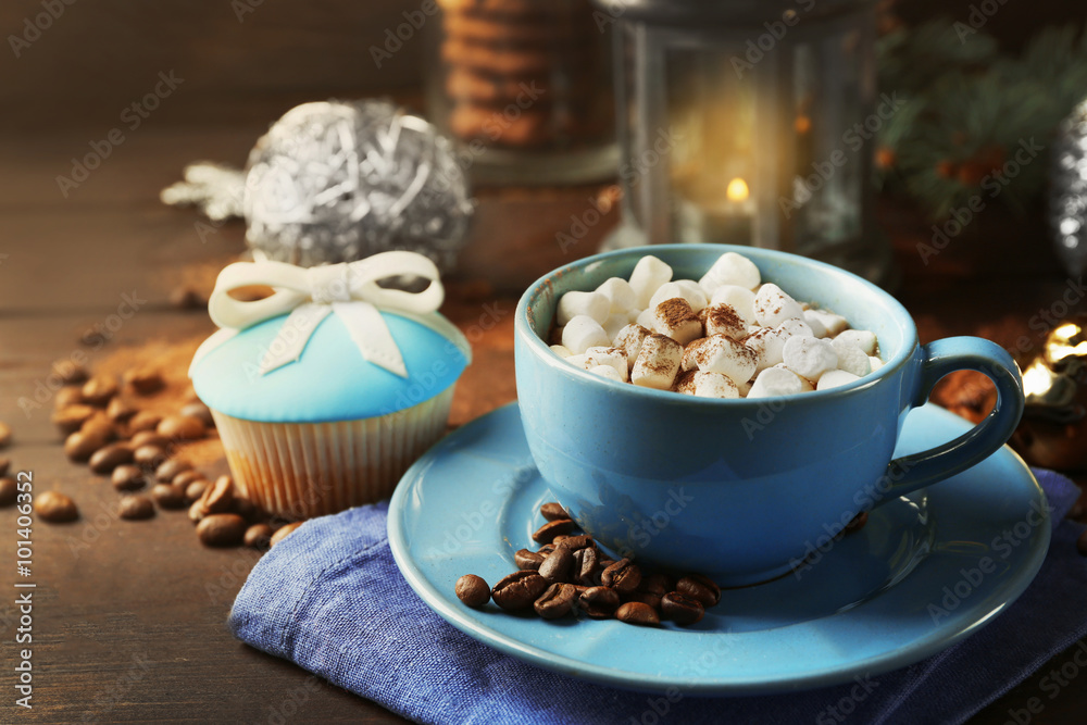 Mug of hot chocolate with marshmallows, fir tree branch on wooden background Mug of hot chocolate with marshmallows, fir tree branch on wooden background