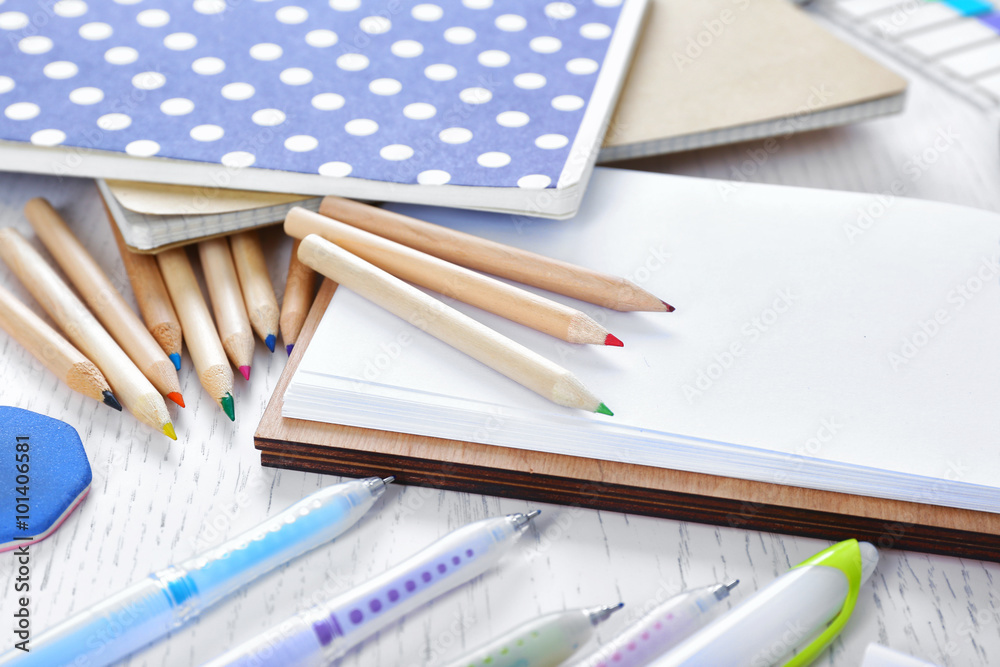 Obraz premium Notebooks with stationery on a white table