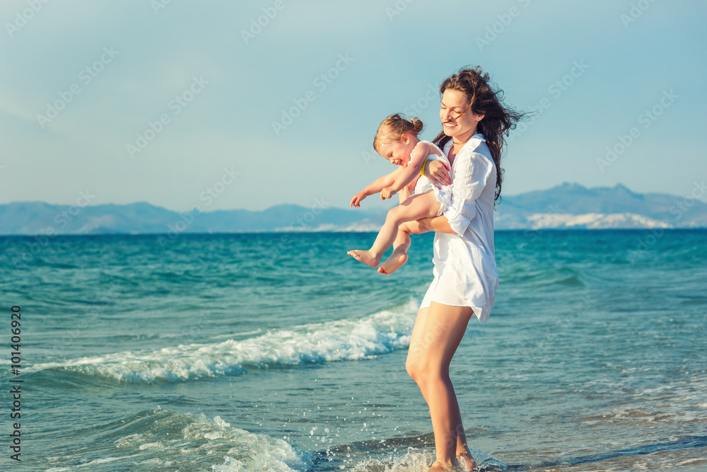 Mother and daughter playing on the beach Mother and daughter playing on the beach