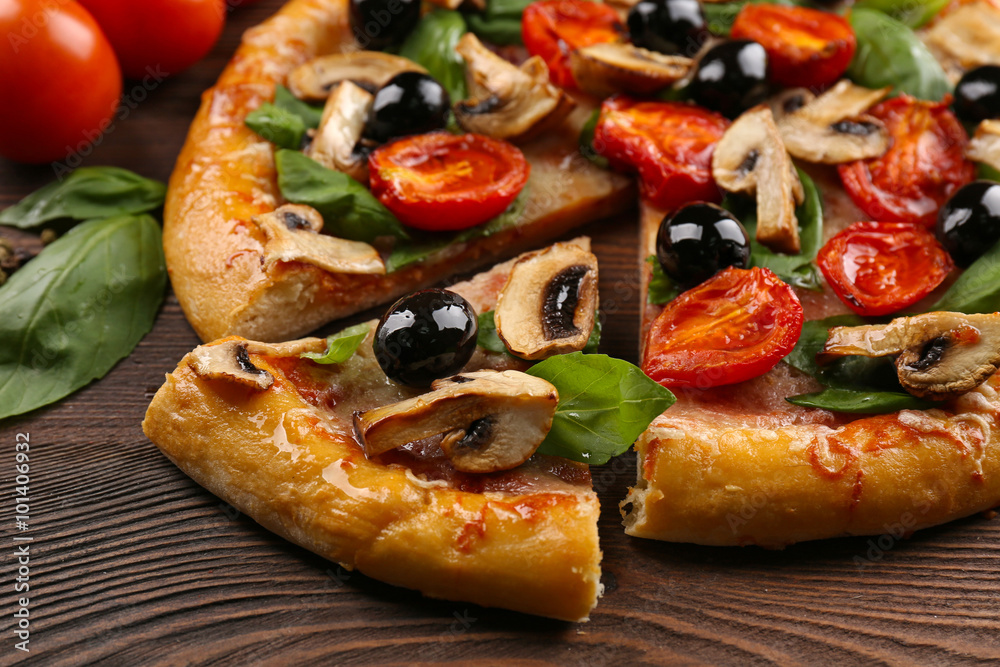 Sliced delicious tasty pizza, closeup Sliced delicious tasty pizza, closeup