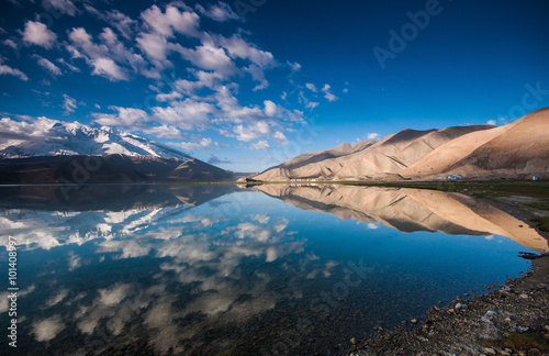 Stunning landscape reflection of Karakul lake in Xinjiang, China. photo