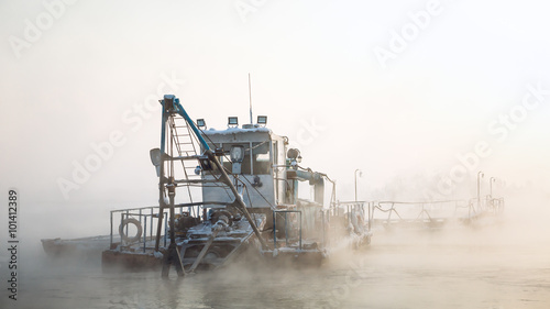 Canvas Print dredge boat in the fog