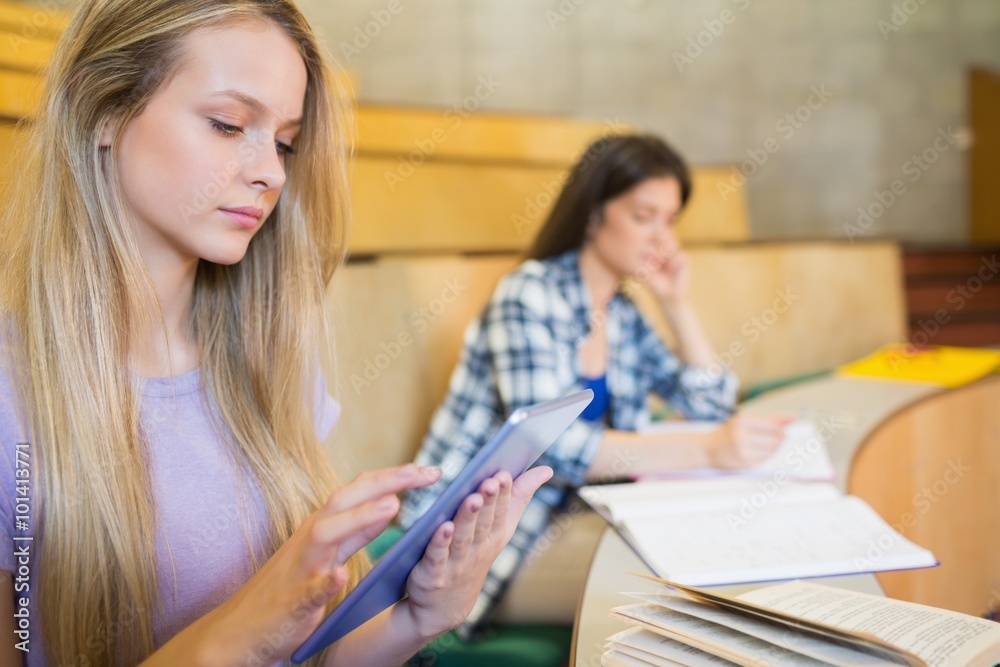 Pretty blonde student using tablet Pretty blonde student using tablet