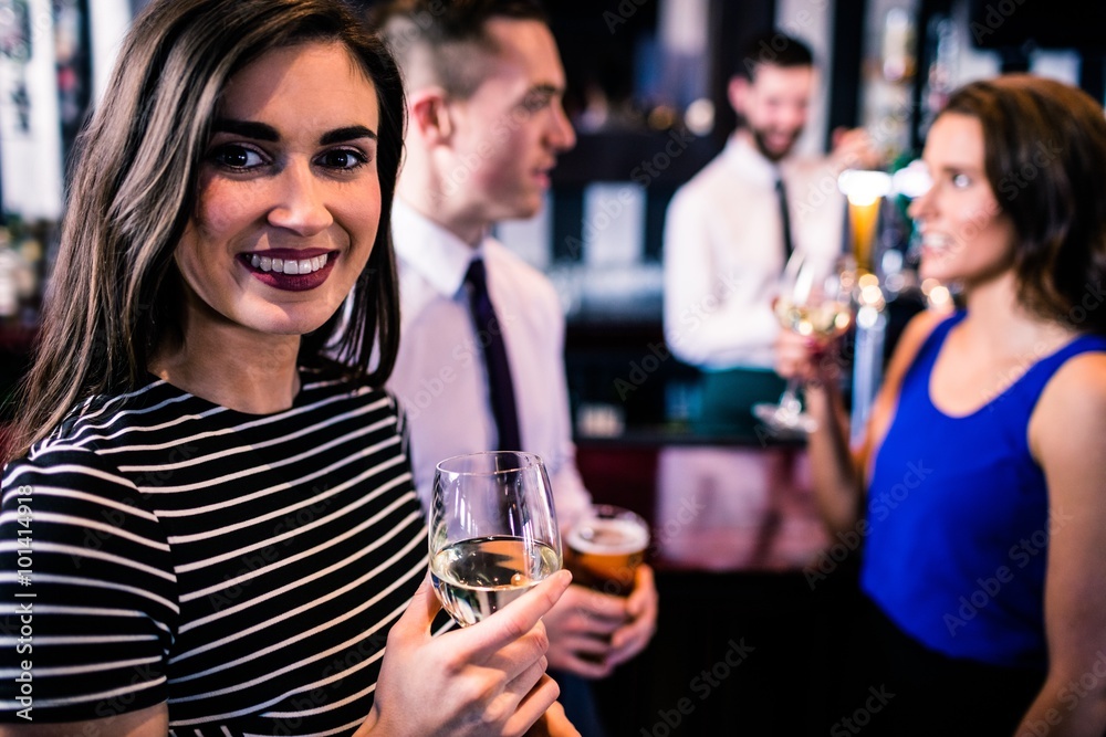 Portrait of woman having a drink with friends Portrait of woman having a drink with friends