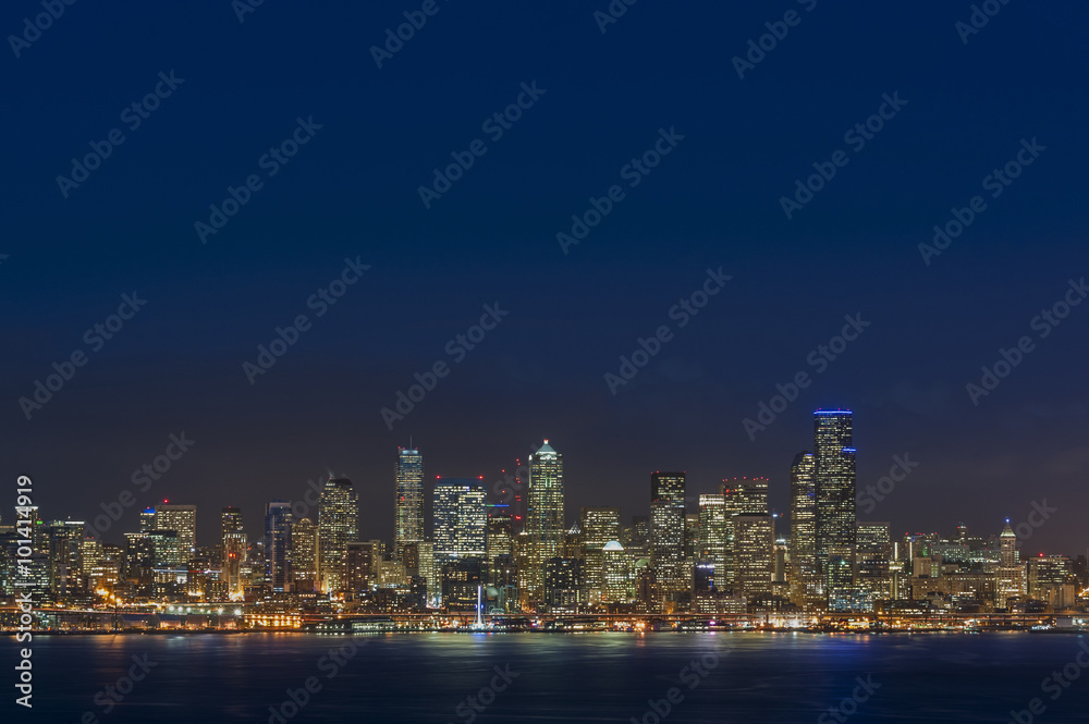 Seattle Skyline. A sunset view of the lovely Seattle, Washington cityscape taken from Alki beach in West Seattle.