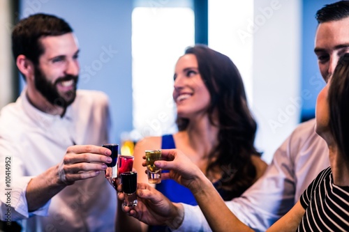 Friends toasting with alcohol shots