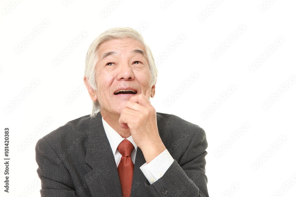 senior Japanese businessman dreaming at his future senior Japanese businessman dreaming at his future