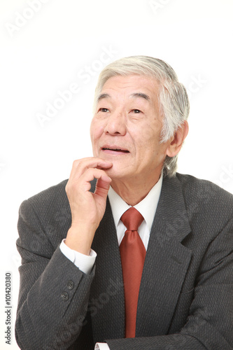 senior Japanese businessman thinks about something © jedi-master
